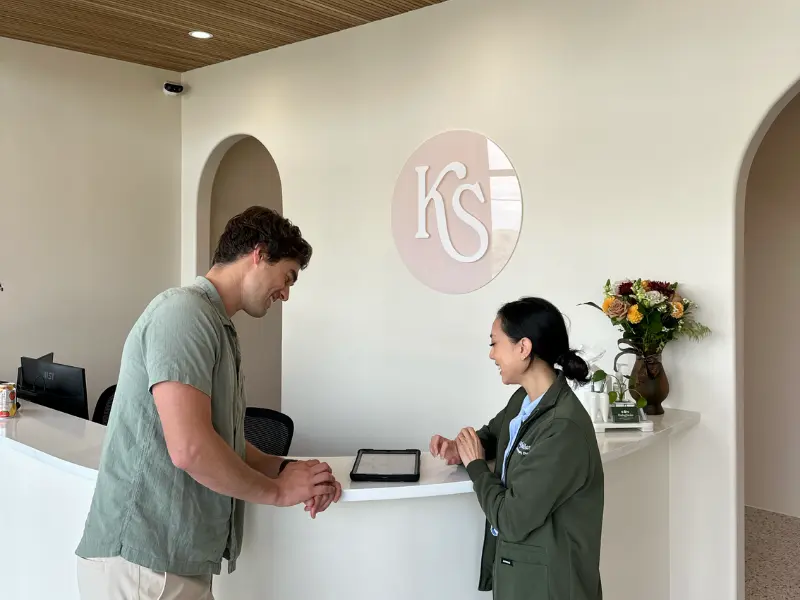 Dr. Pauline tending to an emergency dentistry patient in McKinney