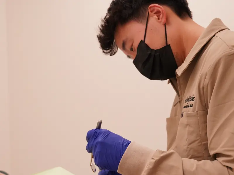 Dr. Howard preparing a patient for dentures in McKinney